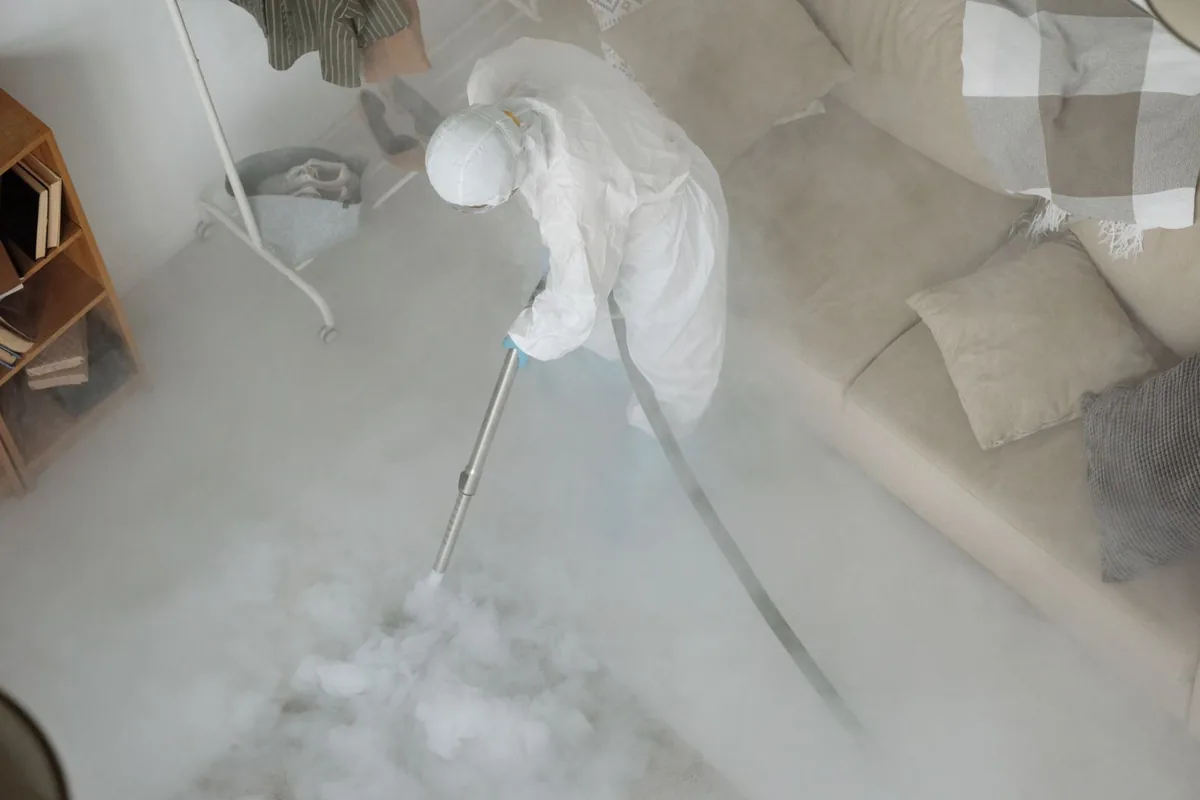 Biohazard cleanup technician in protective equipment, Braddock, PA